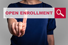 image with magnifying glass and text that reads open enrollment